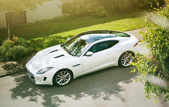 Flash sports car on drive to promote car insurance broker Full-time Cover