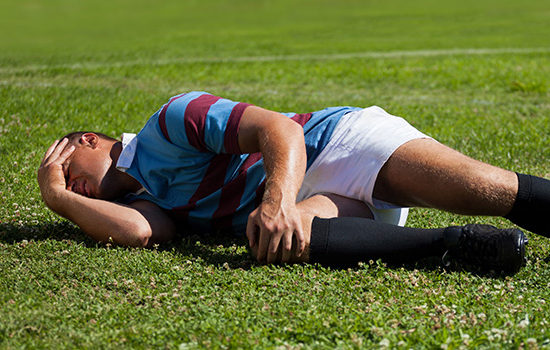 Injured sportsman on pitch to promote leading career ending insurance broker Full-time Cover