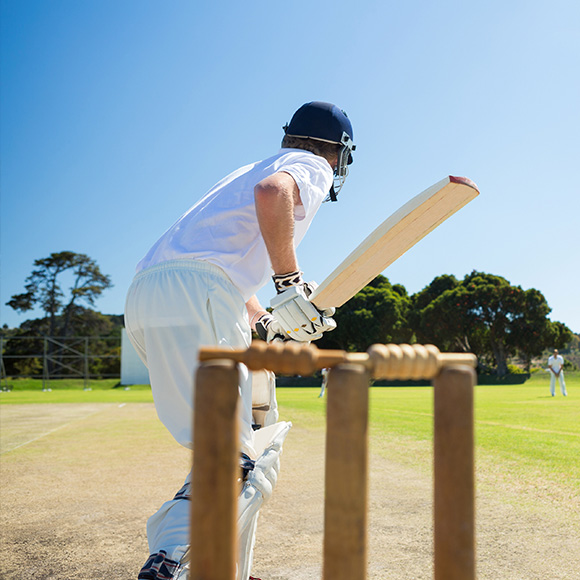 Cricketer on pitch to promote leading cricket insurance broker Full-time Cover