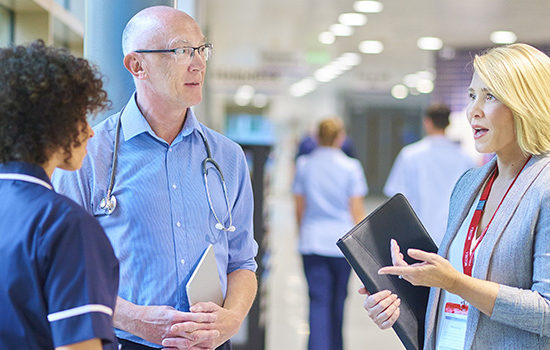 Health workers in discussion to promote health and life insurance broker Full-time Cover