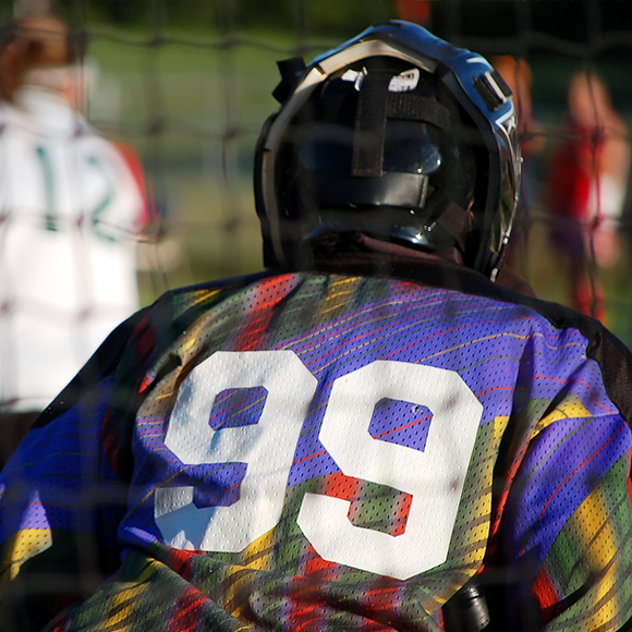 Back of hockey player in action to promote leading hockey insurance broker Full-time Cover