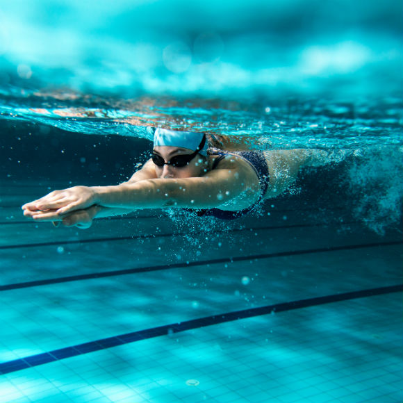 Swimmer in action to promote leading swimming insurance brokers Full-Time Cover