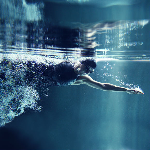 Swimmer in action to promote leading swimming insurance brokers Full-Time Cover