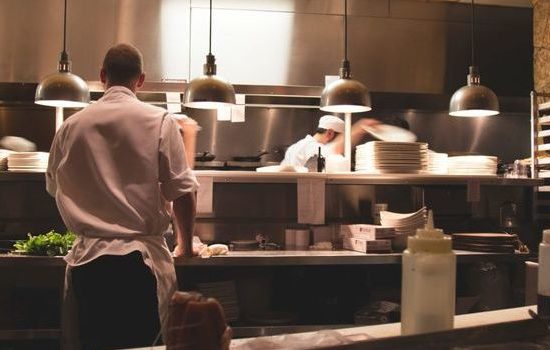 Commercial kitchen in operation to promote leading hotel insurance brokers full time cover