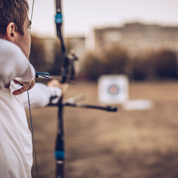 Male practicing archery to promote Full Time Cover's Sports Shooting Insurance