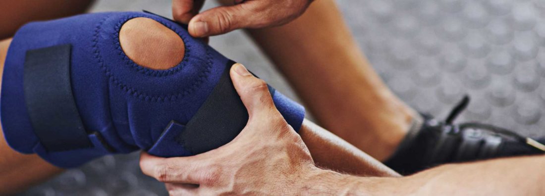 Shot of sports professional being treated for an injury to promote leading career ending insurance brokers full time cover